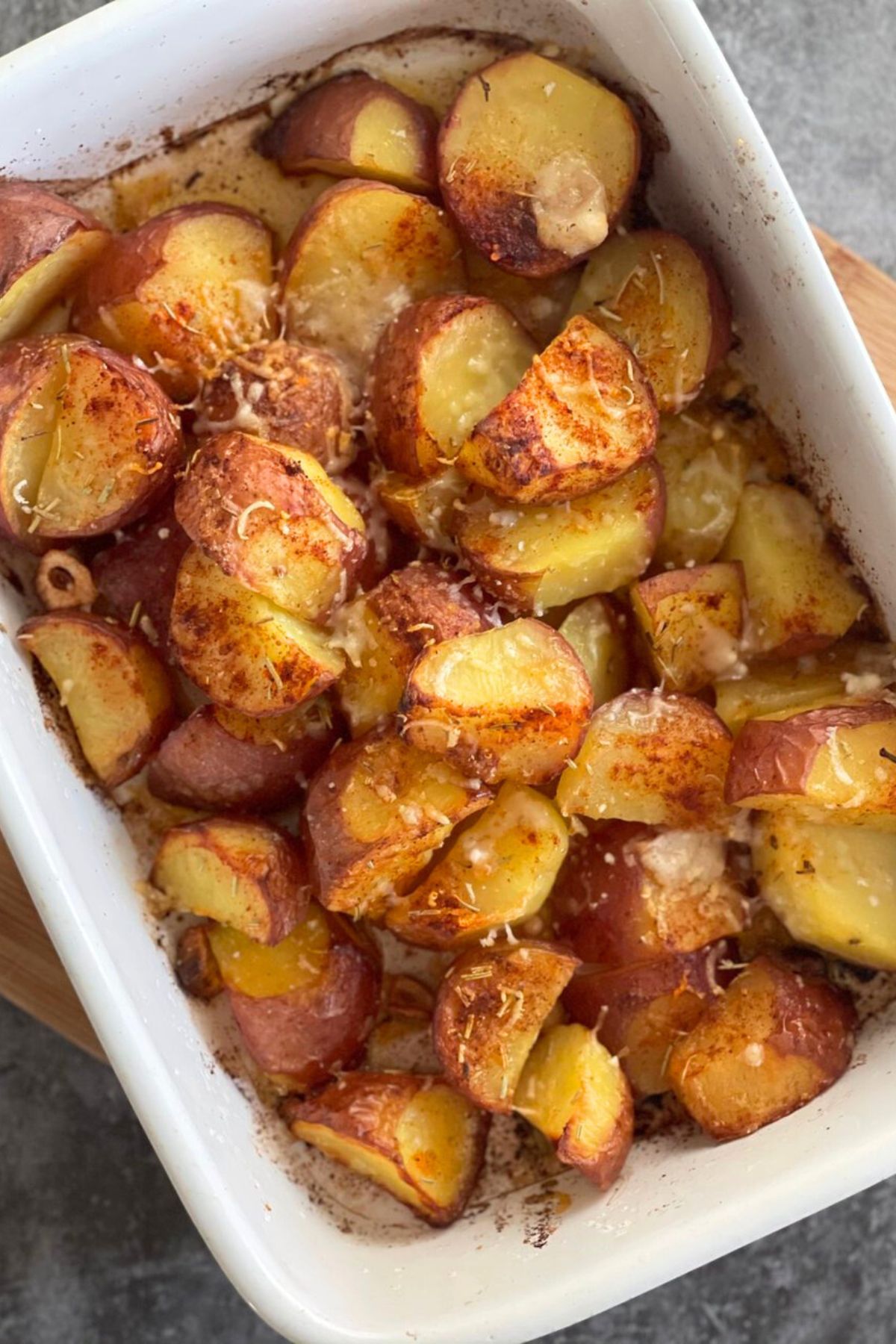 Baked Potatoes in a white ceramic dish 