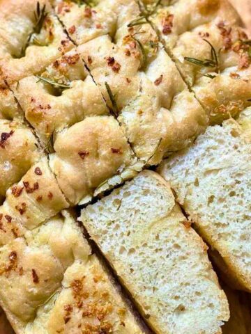 Italian Focaccia Bread Recipe with, rosemary, and extra virgin olive oil, seasoned with Himalayan salt.