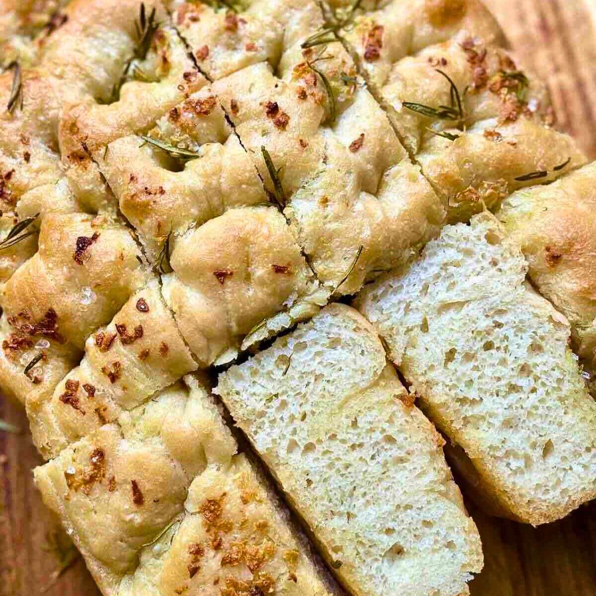 Italian Focaccia Bread Recipe with, rosemary, and extra virgin olive oil, seasoned with Himalayan salt.