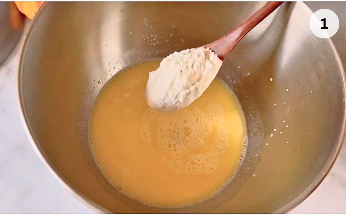 Simple 3-strand challah bread starter foaming in a bowl.
