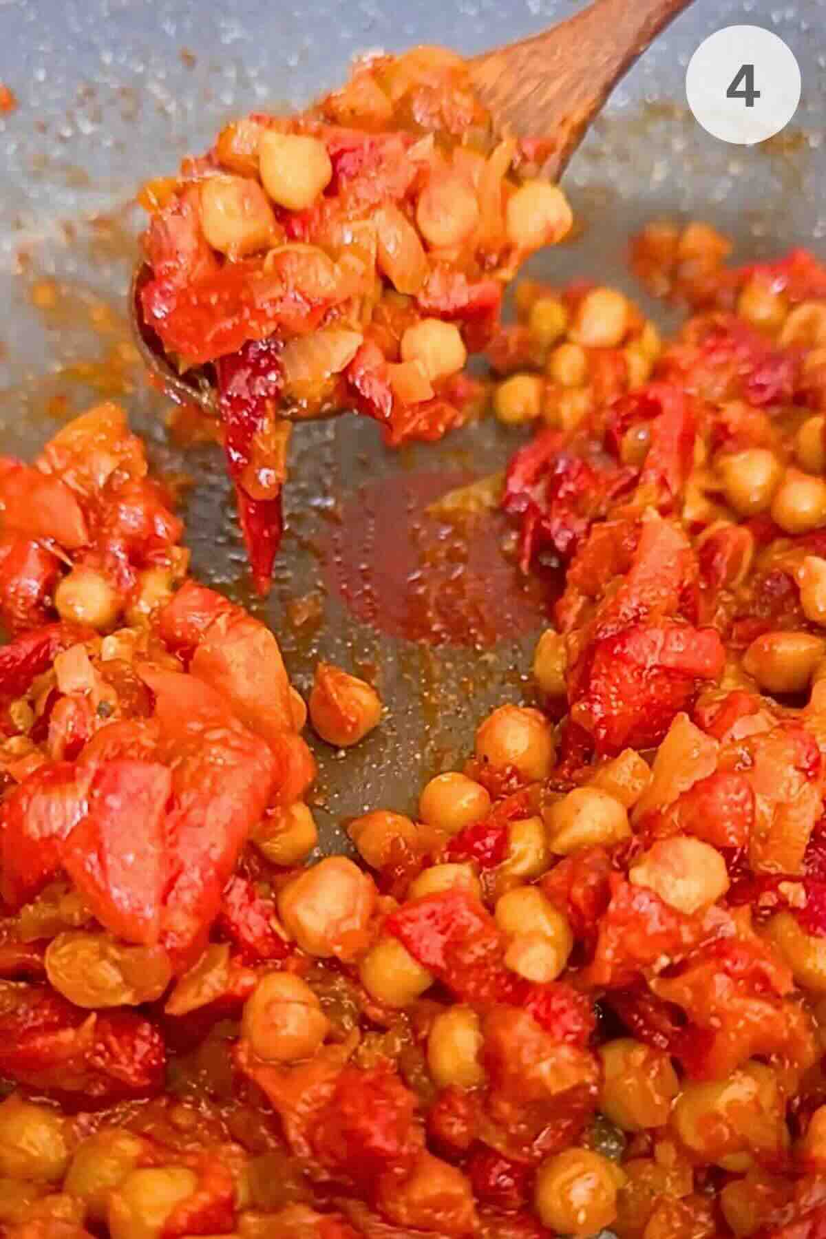 Smoky roasted red pepper and chickpea stew in a pan, ready to serve.