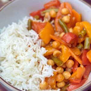Easiest Sweet and Sour Vegetable Stir Fry with chickpeas, bell peppers, carrots, and green beans, a healthy, 30-minute weeknight meal.