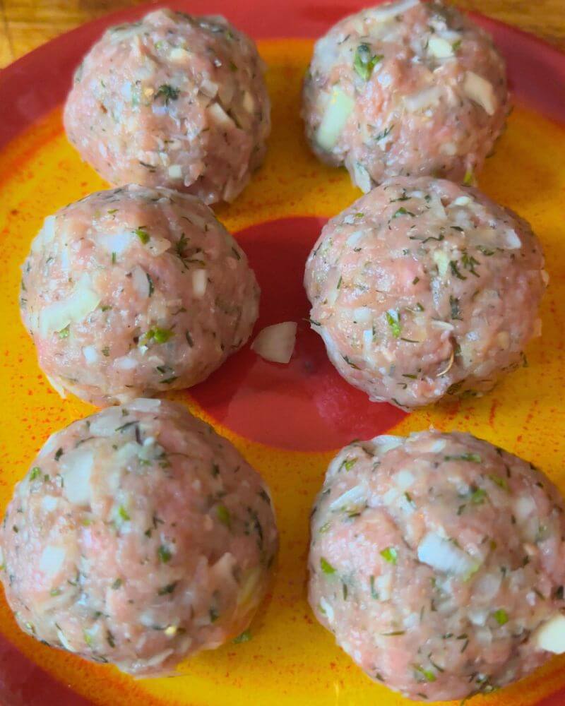 Photo of seasoned kefta balls ready to be smashed for making Smashed Kefta Tacos.