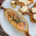 Easy salmon en papillote with lemon slices in parchment paper.