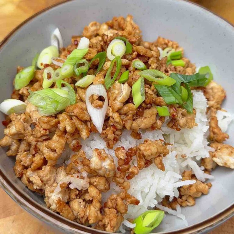 Korean-Style Keema served in a bowl over steamed rice and garnished with green onions