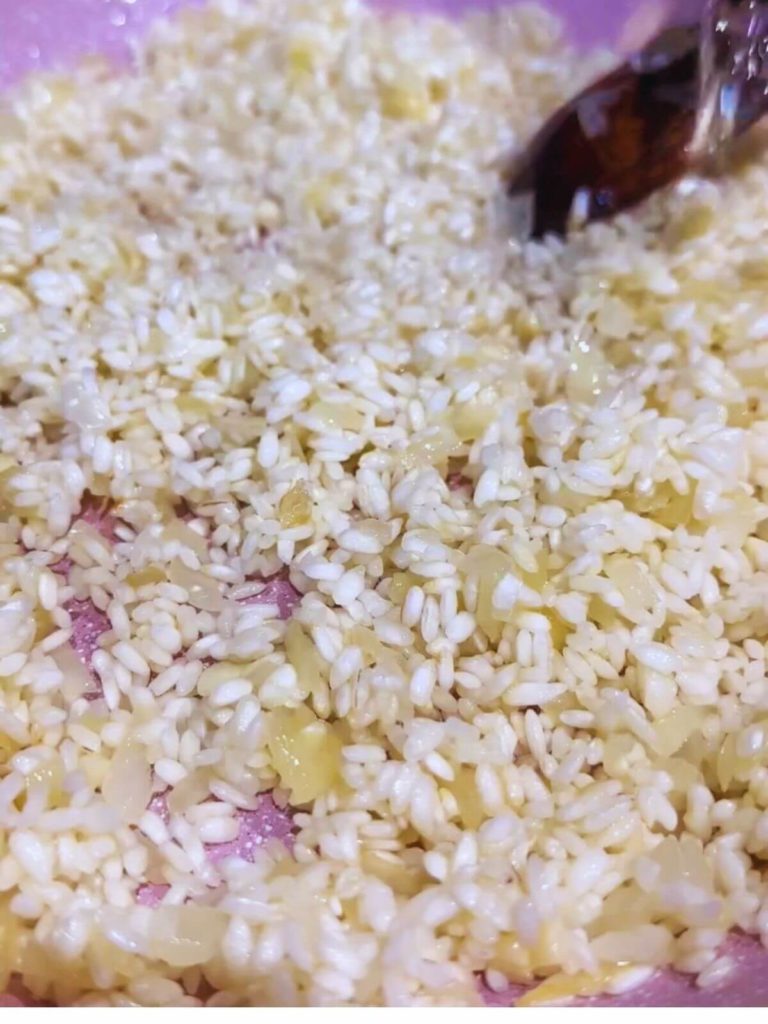 Sauté the onions, garlic, and rice together.