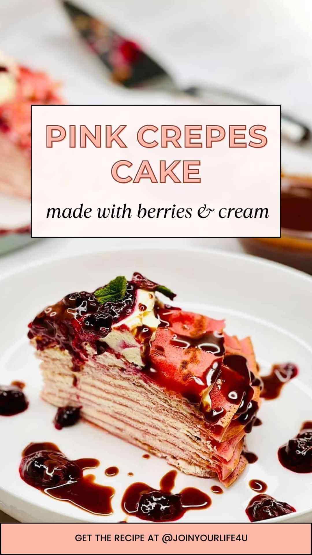 Berry and Cream Pink Crepes Cake featuring layers of delicate crepes filled with cream cheese filling. Decorated with vibrant berry sauce, decadent chocolate ganache, and fresh mint leaves.