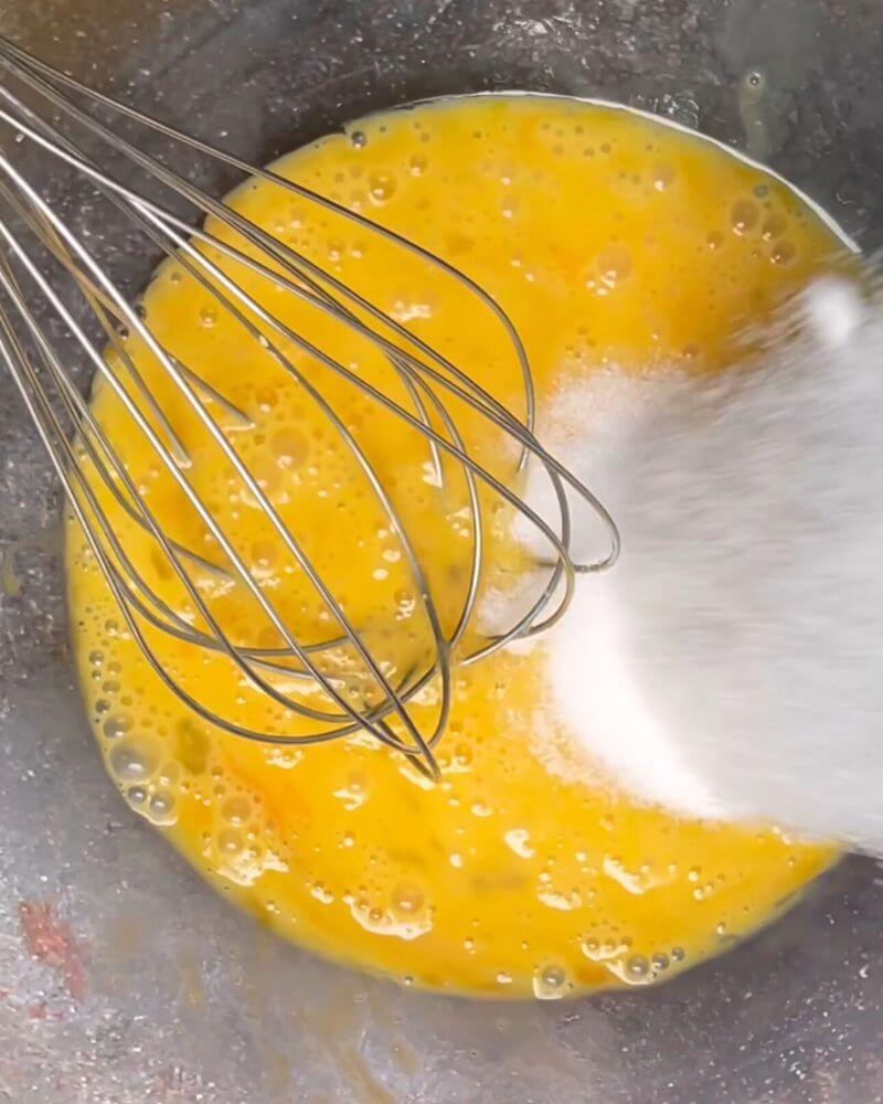 Mixing eggs and sugar for our Flourless Yogurt Cake!