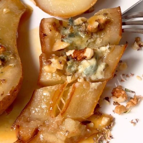 Baked Gorgonzola Pears drizzled with honey and cut into bites.