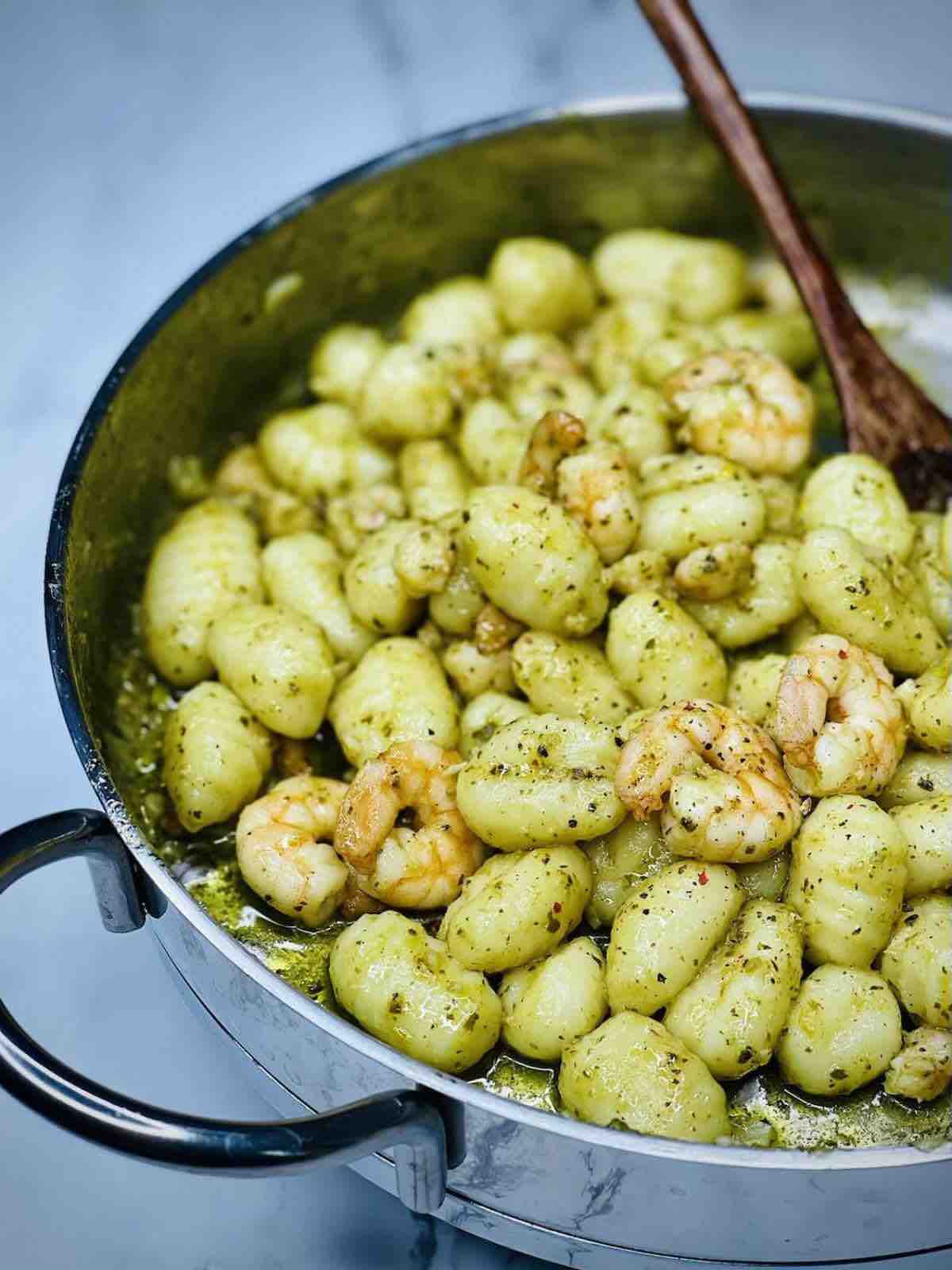 Creamy pesto shrimp gnocchi in a pan