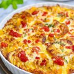 Baked Potato Frittata in a round ceramic dish with a golden, crispy top.