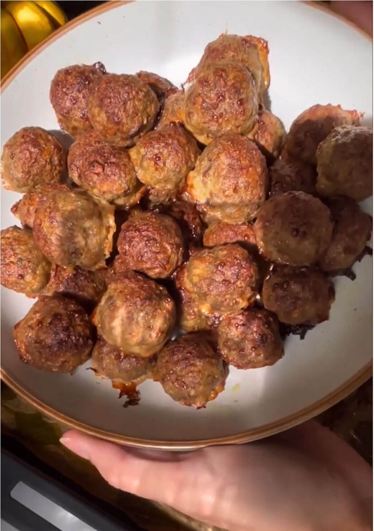 Baked turkey meatballs in a shallow bowl. 
