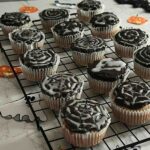 Easy chocolate Halloween spider web cupcakes decorated with royal icing for a spooky look.