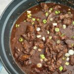 Korean beef rice bowl with authentic bulgogi sirloin in a ceramic pan.