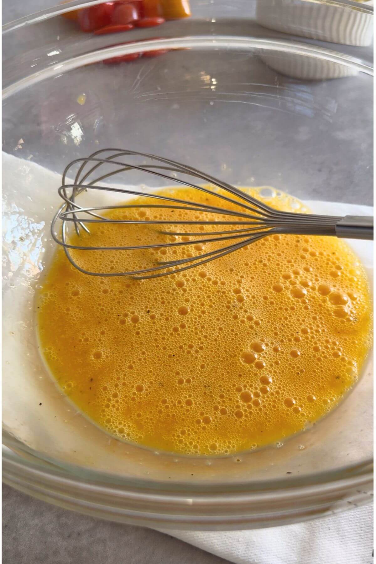 Seasoning low-carb egg muffin mixture. 