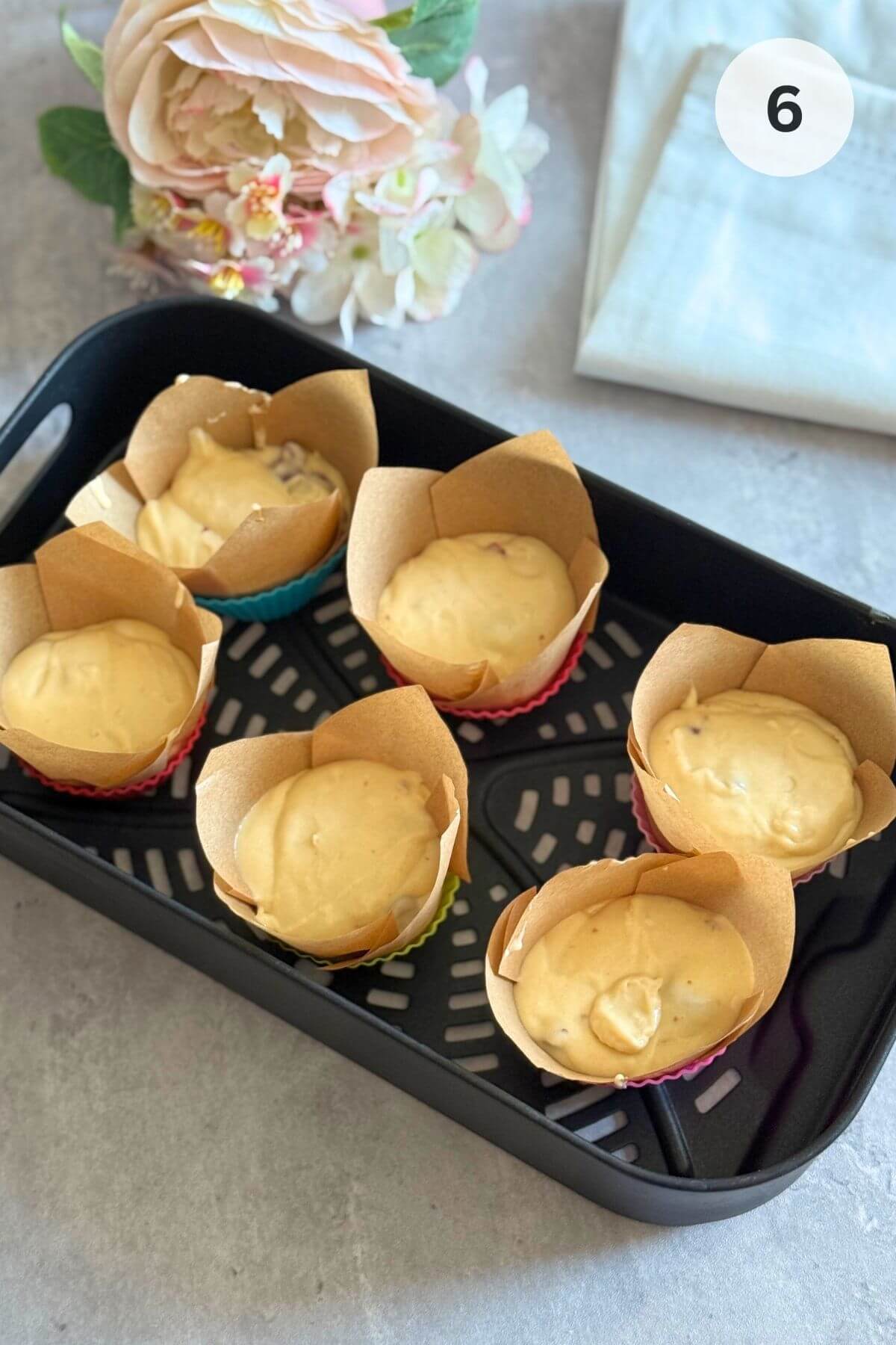 Spoon batter into lined silicone cups or greased tray.
