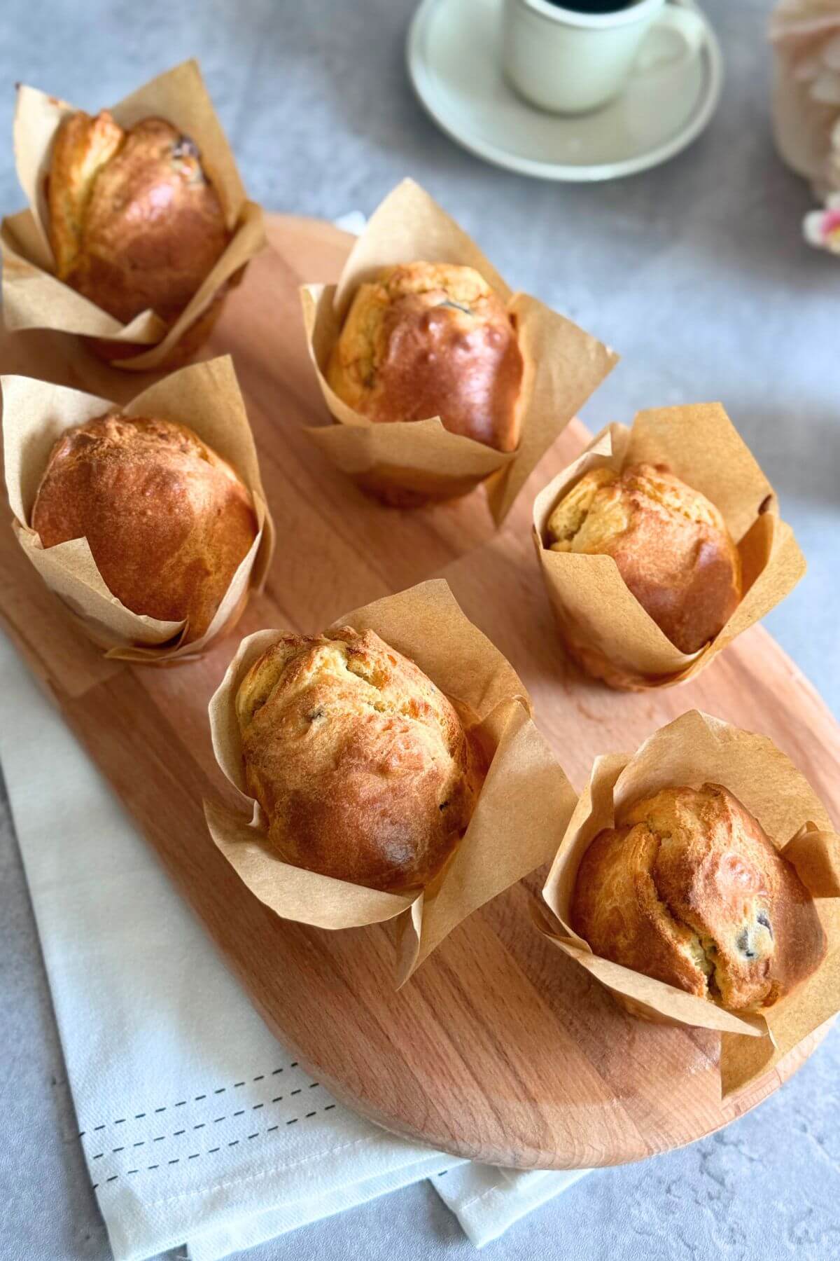 Fluffy sour cherry muffins on an oval wooden board, no butter, 6 ingredients.