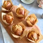 Fluffy sour cherry muffins on an oval wooden board, no butter, 6 ingredients.