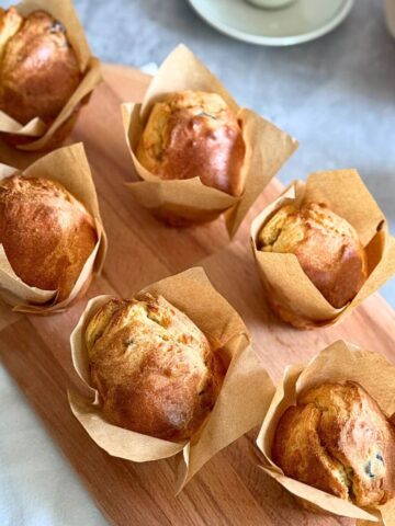 Fluffy sour cherry muffins on an oval wooden board, no butter, 6 ingredients.