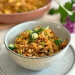 Leftover lamb fried rice served in a bowl with green onions.
