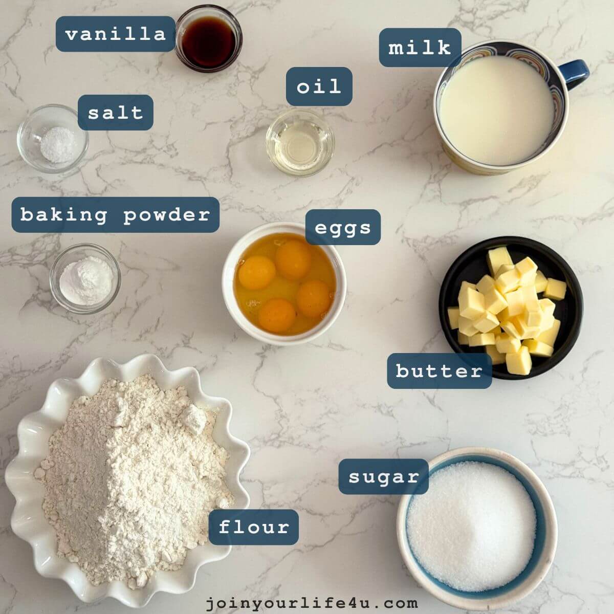 All-purpose flour, baking powder, salt, eggs, sugar, melted butter, milk, oil, vanilla, individually displayed on a table. 