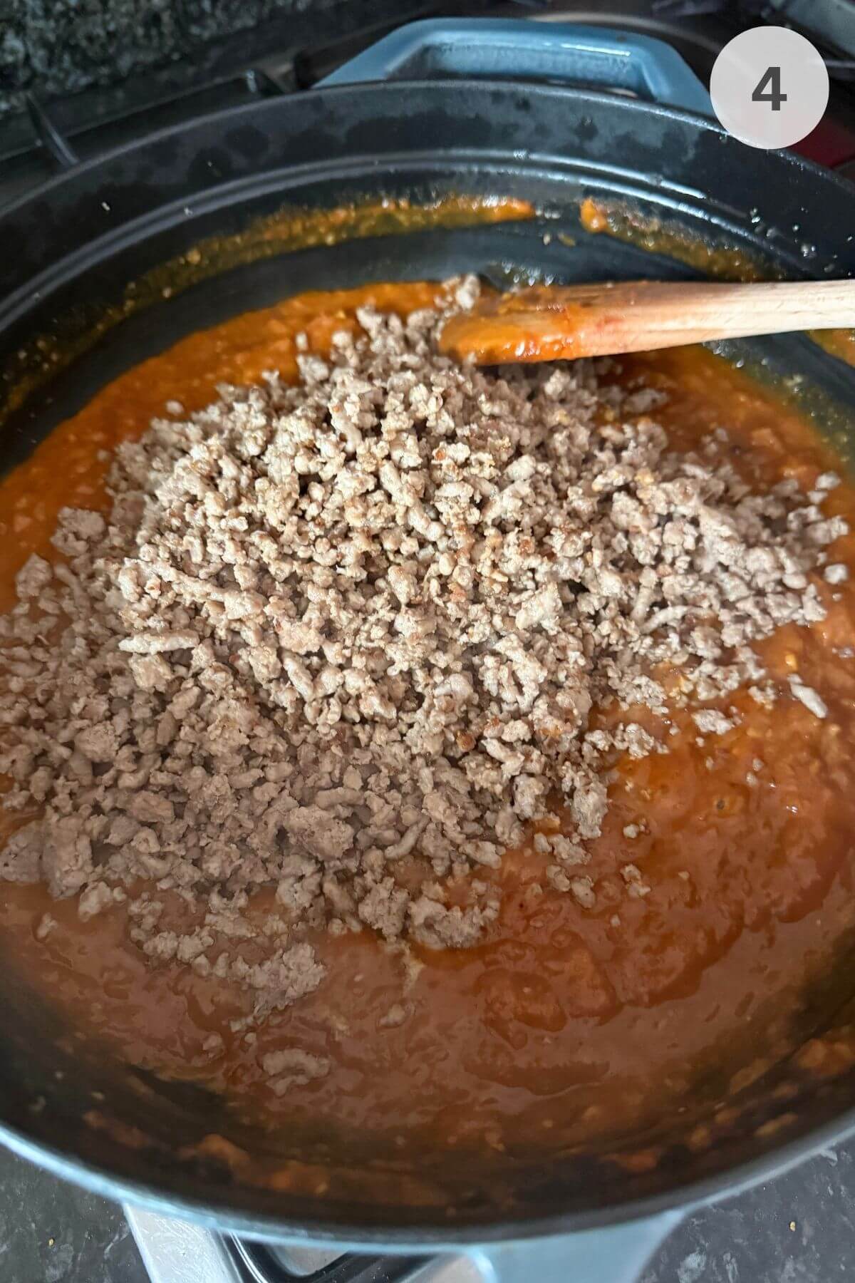 Curry paste in pan loosened with stock, with browned ground turkey just stirred back in.
