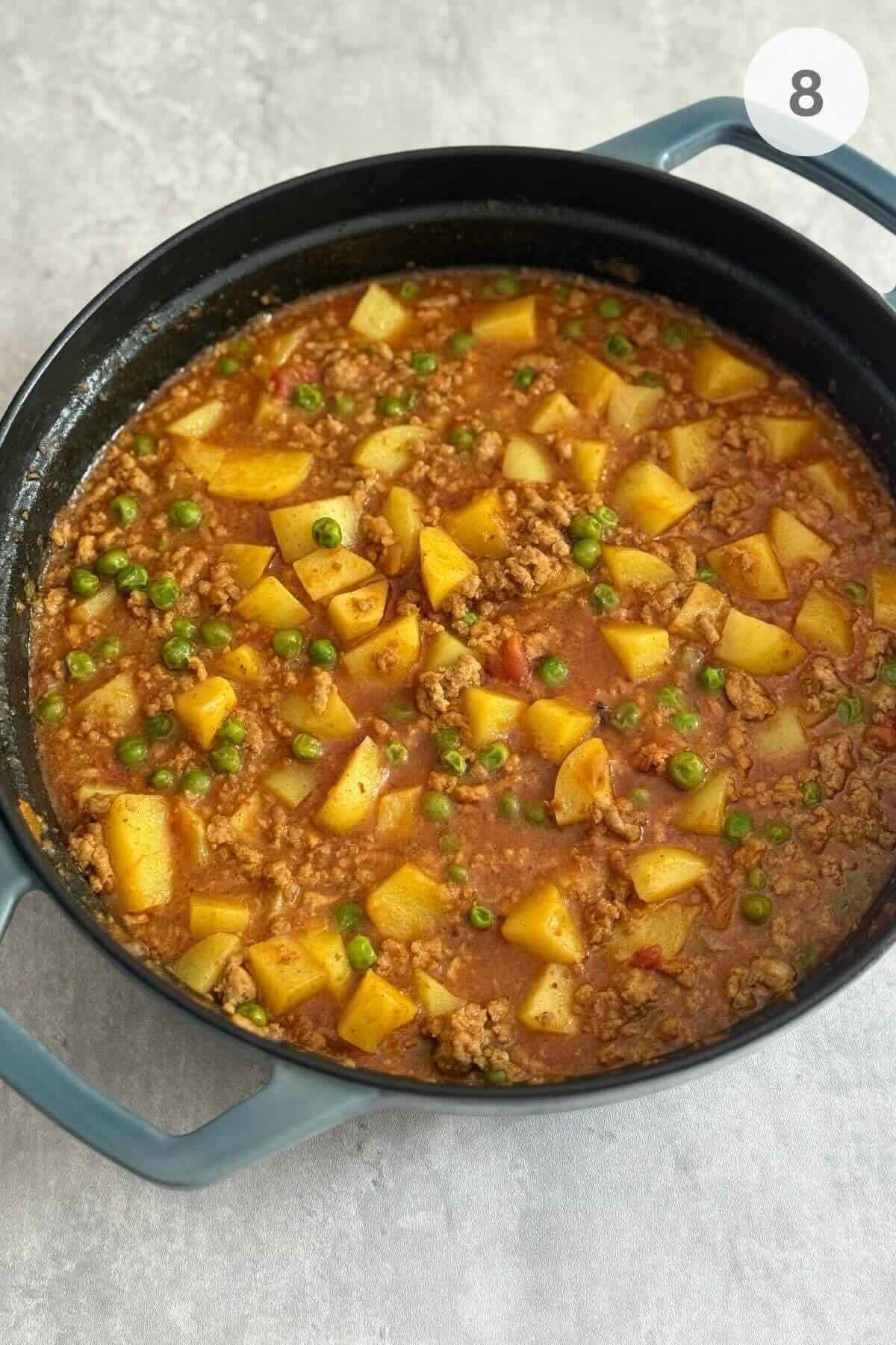 Homemade thai turkey curry in a ceramic pan. 