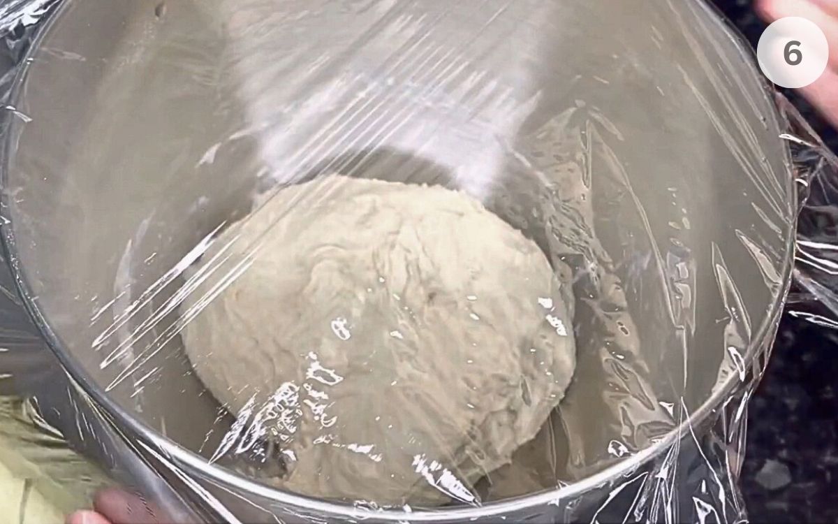 Bowl covered with cling film or a towel and left in a warm spot to double in size.