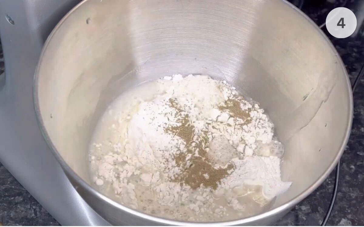 Salt added to the side of the bowl, away from the yeast.