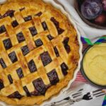 A beautiful easy plum custard tart recipe, golden brown lattice crust, plums, vanilla custard.