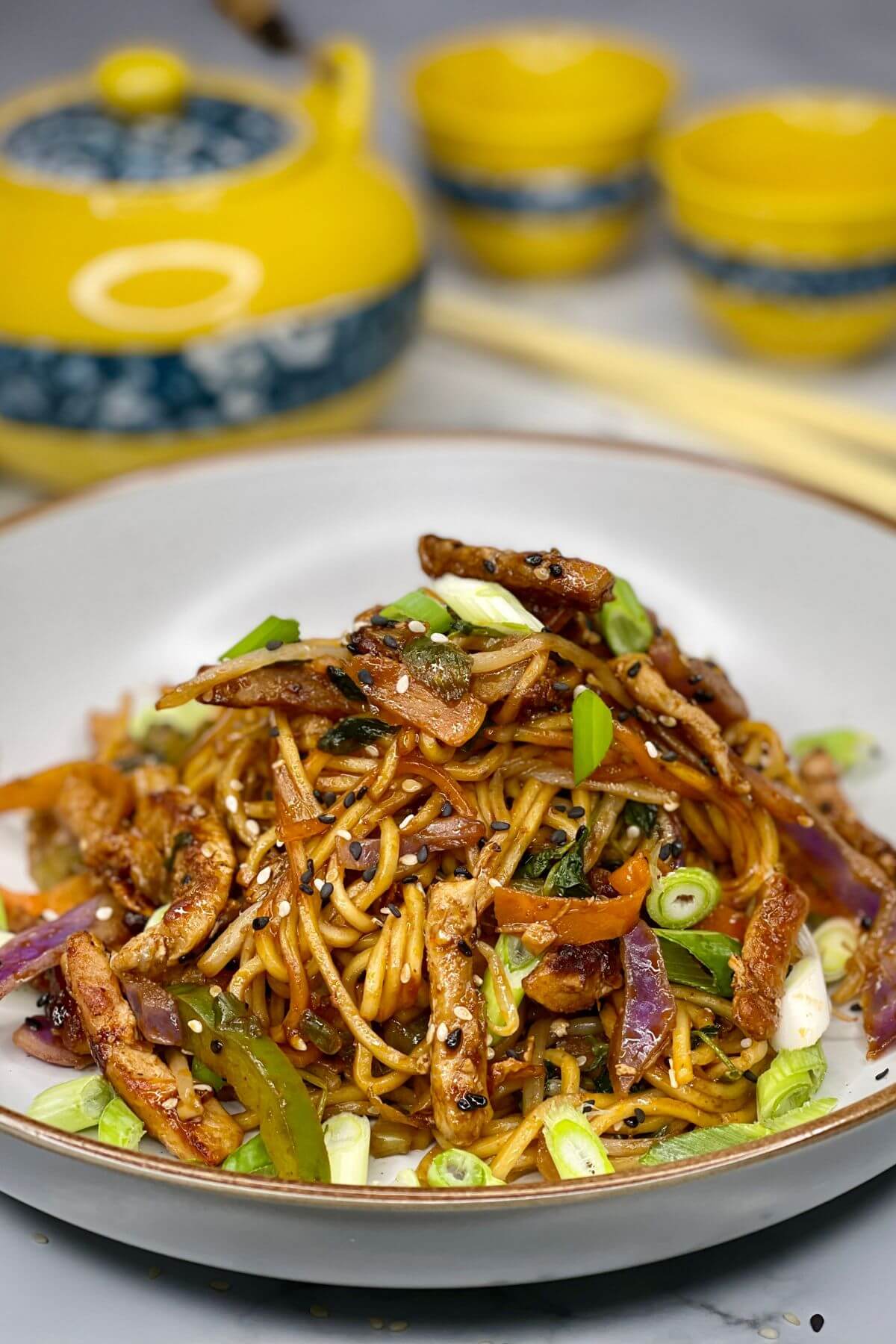 Fresh egg noodles tossed with teriyaki pork, lime zest, and colorful vegetables for a quick weeknight dinner.
