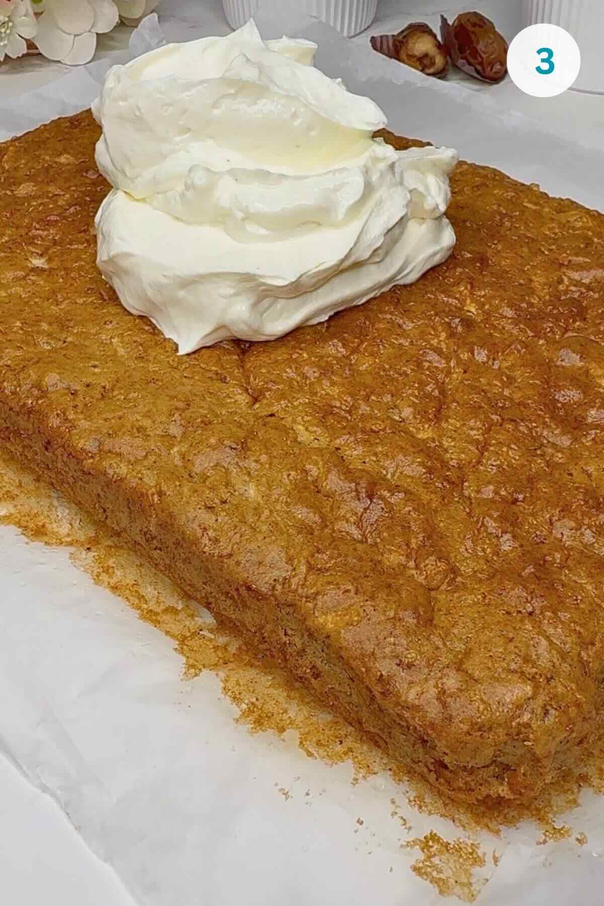 Cake cooled on a wire rack while cream cheese frosting and date caramel were prepared.
