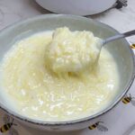 Warm Romanian Fidea cu Lapte, or sweet milk vermicelli, served in a bowl.