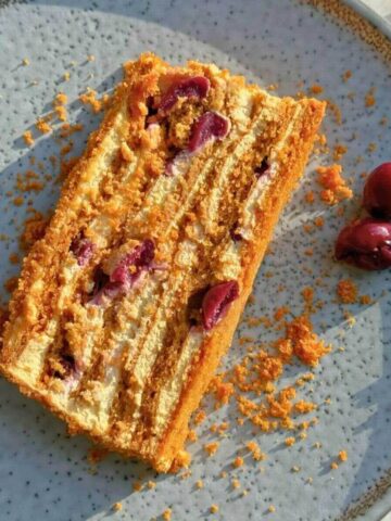 Russian Medovik honey cake with thin golden layers and cream filling.