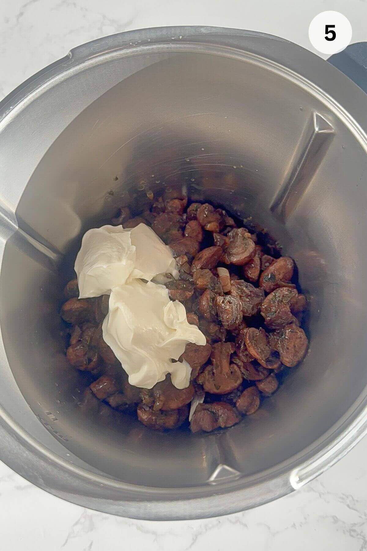 Cooked mushroom added with cream cheese into a food processor before blending into creamy pâté.