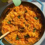 One-pan lazy lasagna with ricotta and fresh basil in a cast iron skillet.