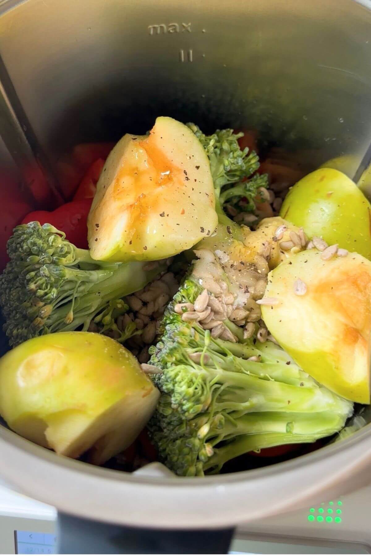 Add salad ingredients added to the mixer container, including the dressing.