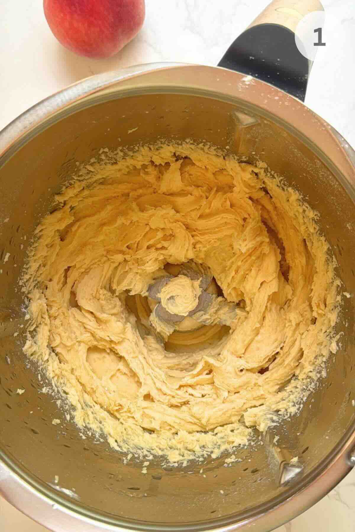 Showing pastry dough formed from mixed flour, cold butter, and sugar.