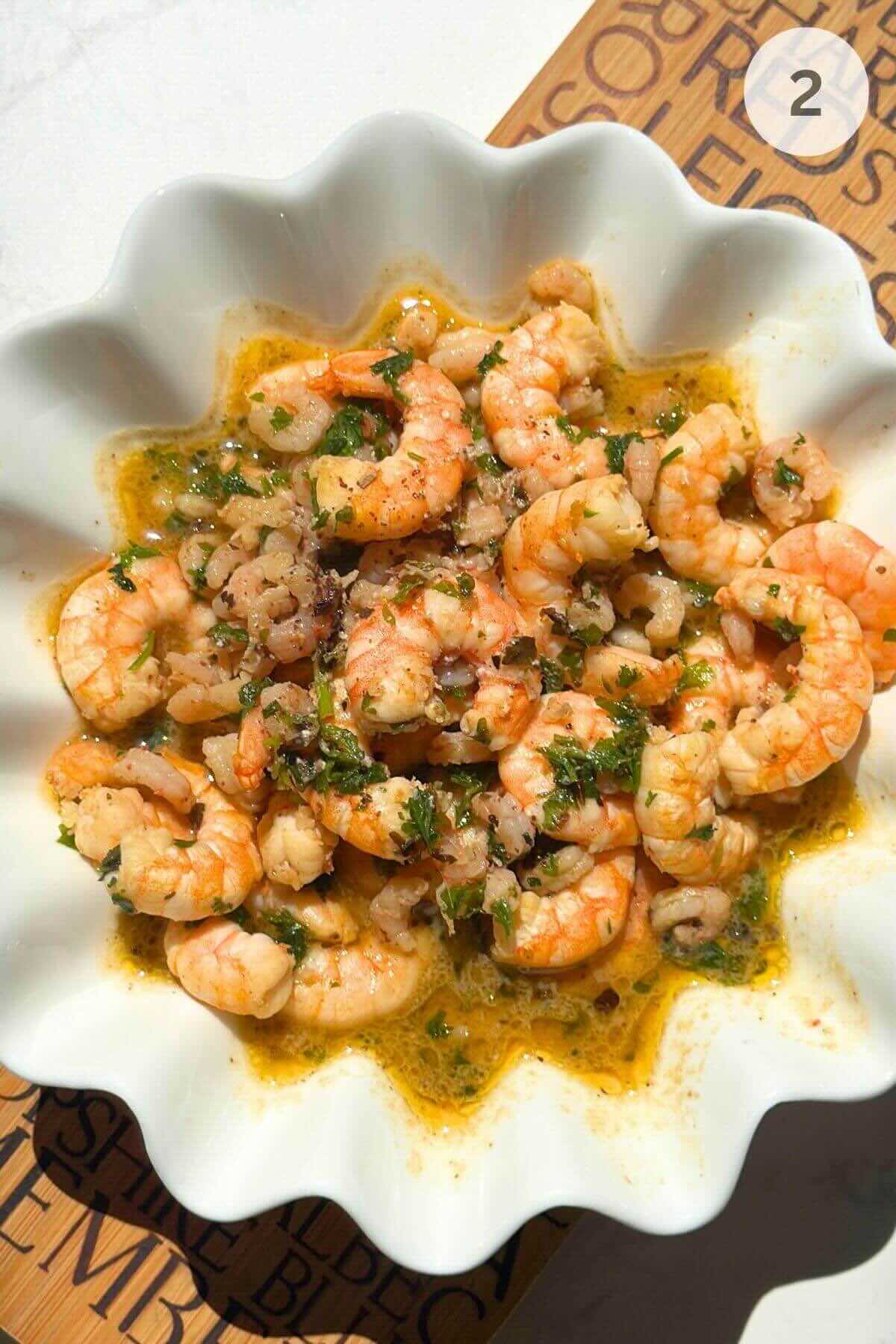 Cooked shrimp transferred to a bowl after cooking for one pot linguine pasta.