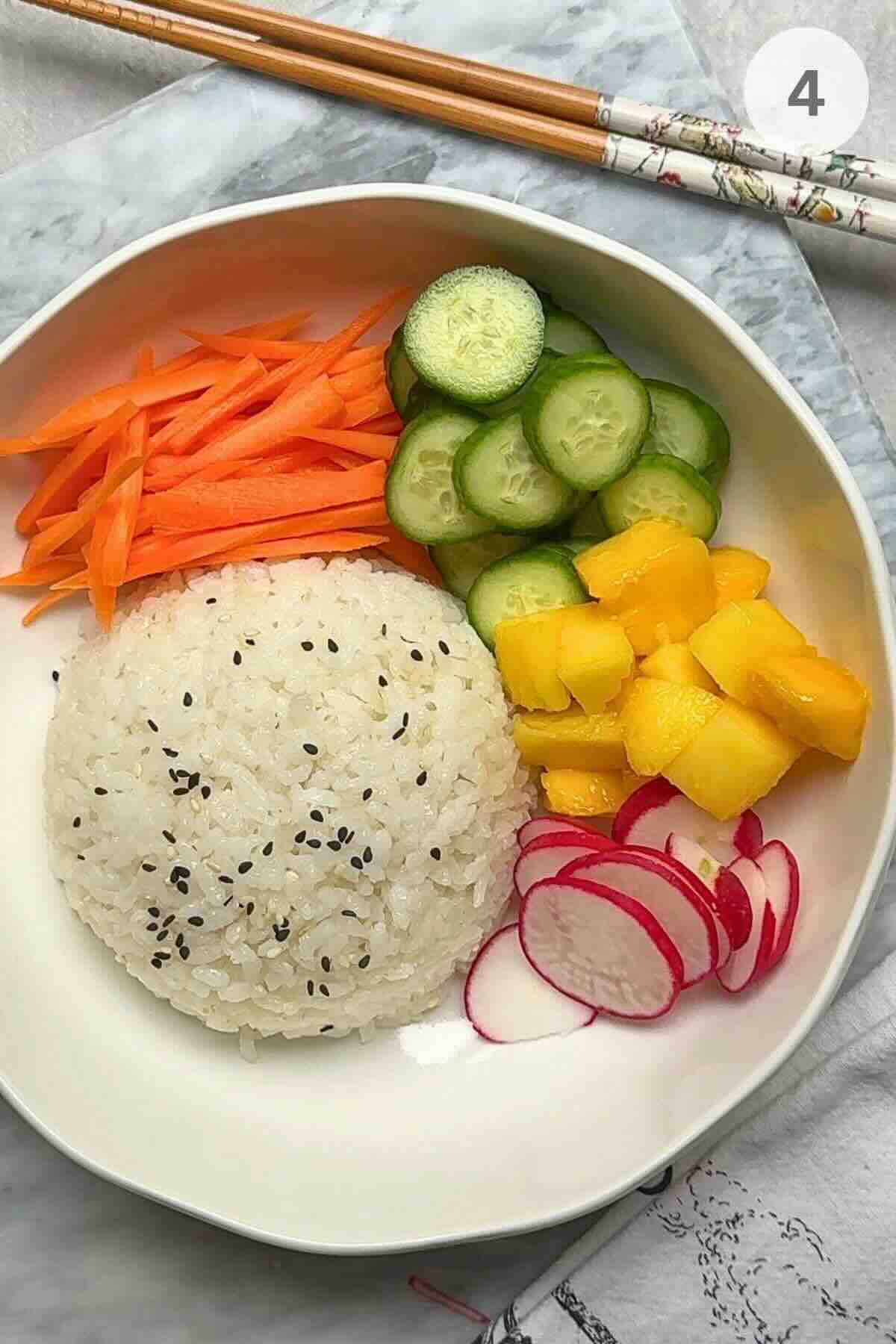 Assembling a colorful seared tuna poke bowl with rice, veggies, and sriracha.