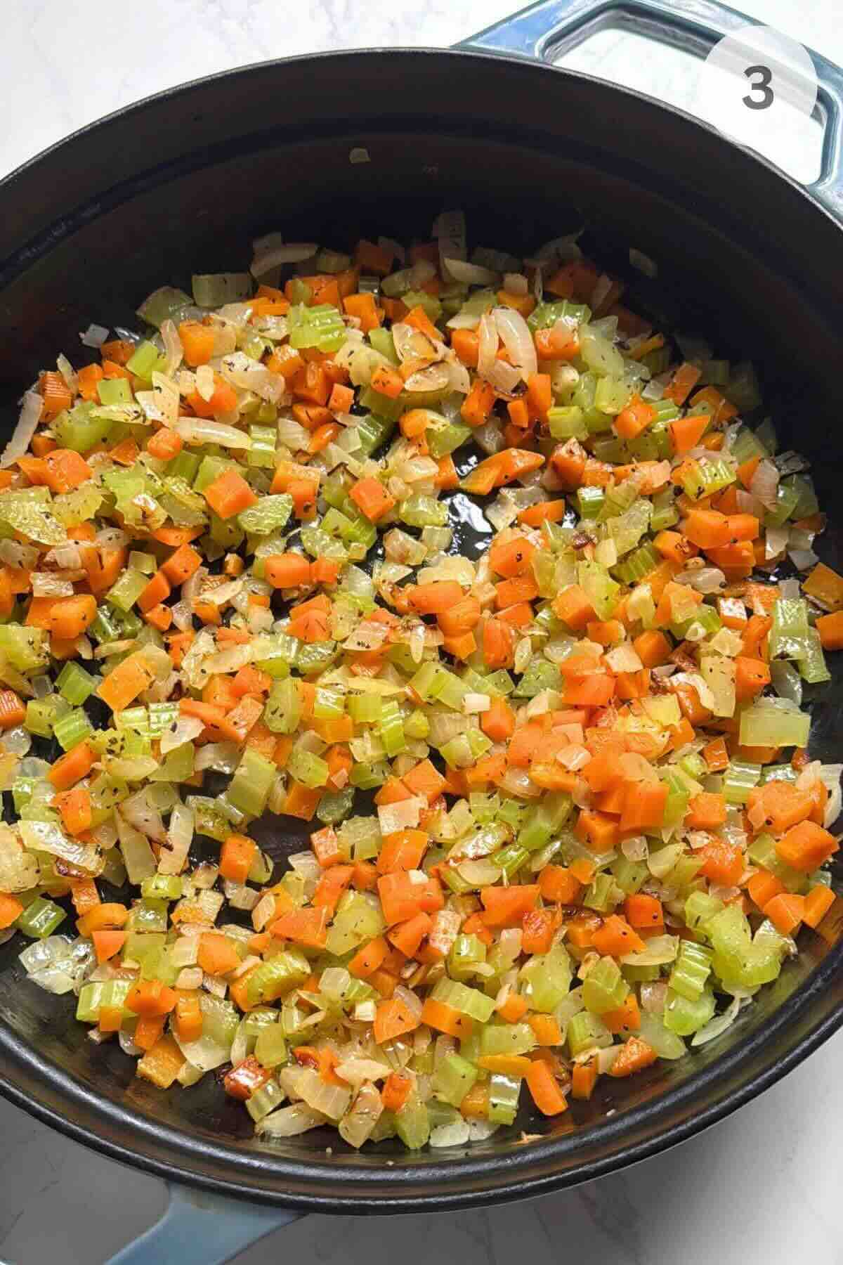 Diced carrots, celery, and onion sautéing in butter with flour stirred in.