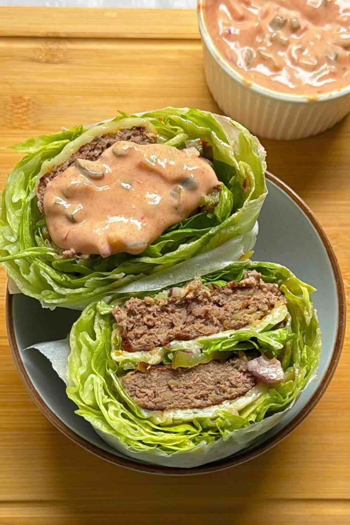 Big Mac lettuce wrap cut in half showing beef patty, iceberg layers and special sauce.